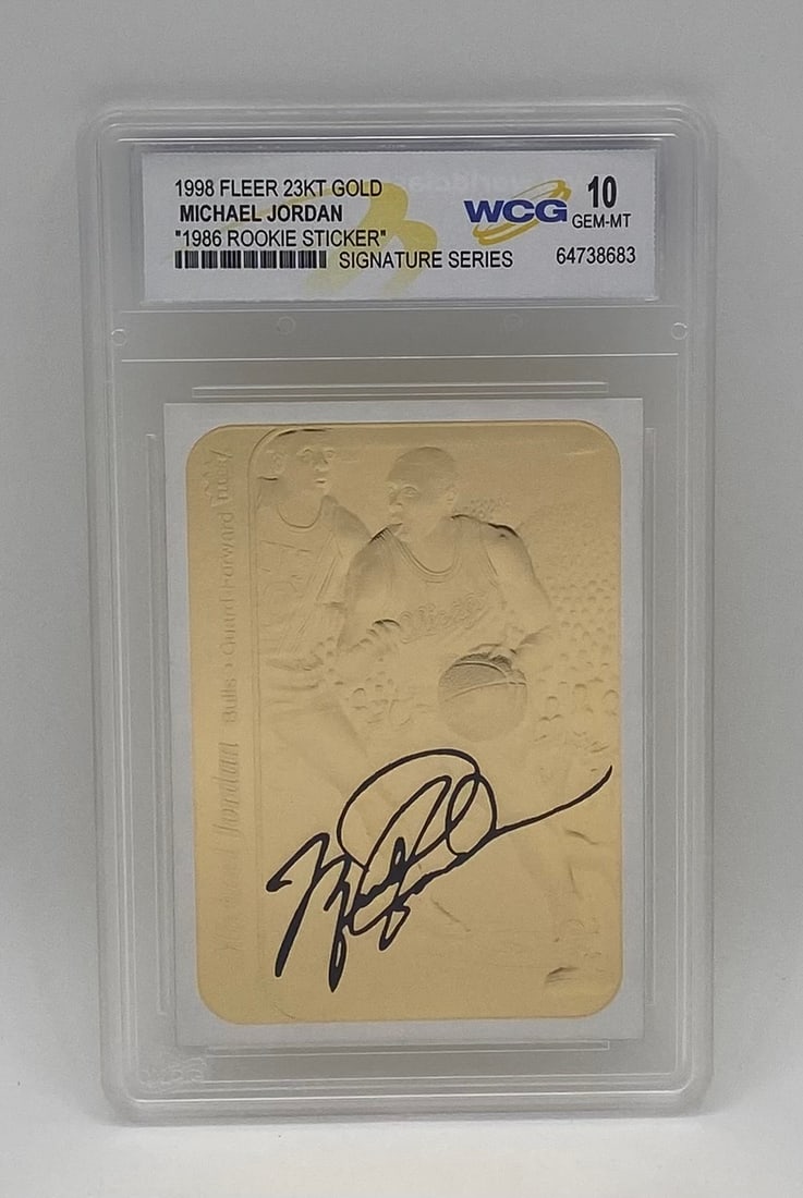 1998 Fleer 23KT Gold Michael Jordan 1986 Rookie Sticker WCG 10 Gem Mint: Single-card lot featuring Chicago Bulls legend Michael Jordan. 1998 Fleer 23-Karat Gold "1986 Rookie Sticker" Signature Series card featuring facsimile signature. Encased and graded WCG 10 Gem Mint.