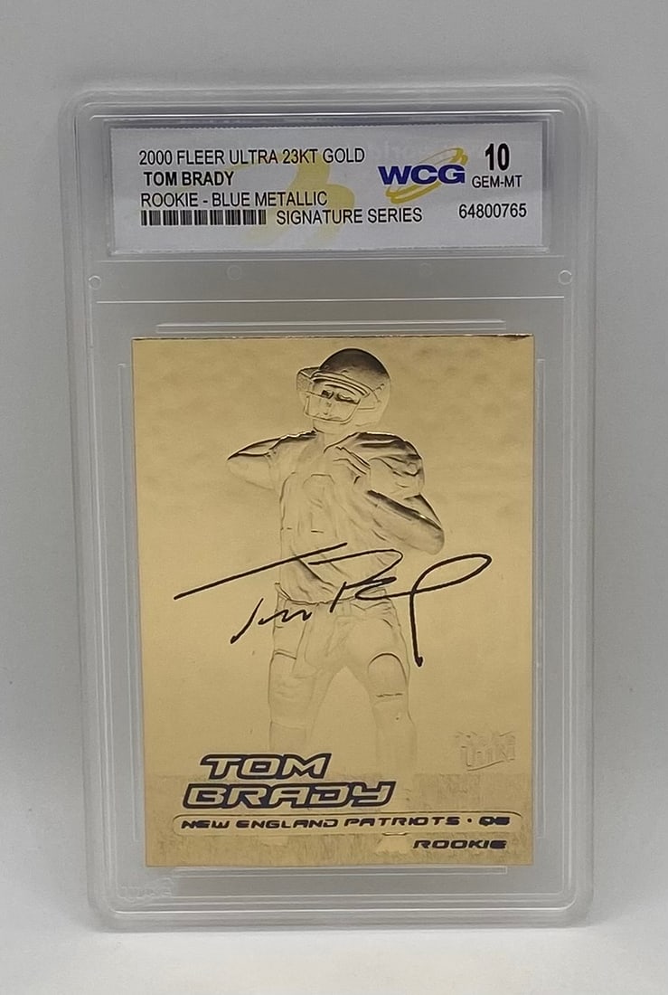 2000 Fleer Ultra 23KT Gold Tom Brady Blue Metallic Sig WCG 10 Gem Mint: Single-card lot featuring legendary New England Patriots QB Tom Brady. 2000 Fleer Ultra 23-Karat Gold Rookie card with Blue Metallic Signature Series foil. Encased and graded WCG 10 Gem Mint.