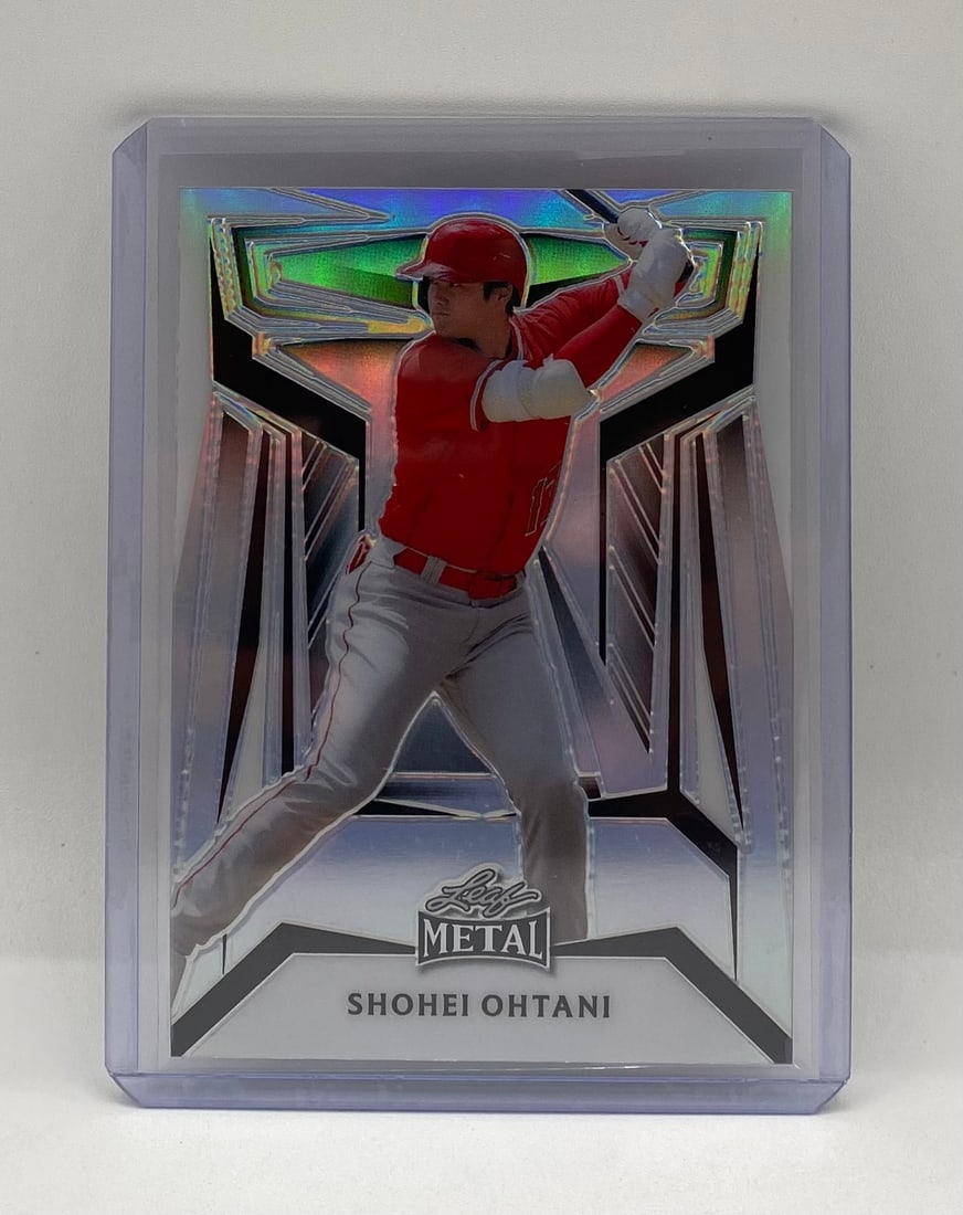 Leaf Metal Shohei Ohtani Metallic Refractor Base Card (Raw/Top Loader): Single-card lot featuring Los Angeles Angels/Dodgers superstar Shohei Ohtani. Leaf Metal metallic refractor card pictured in batting stance. Un-graded raw card presented in protective top-loader sleev