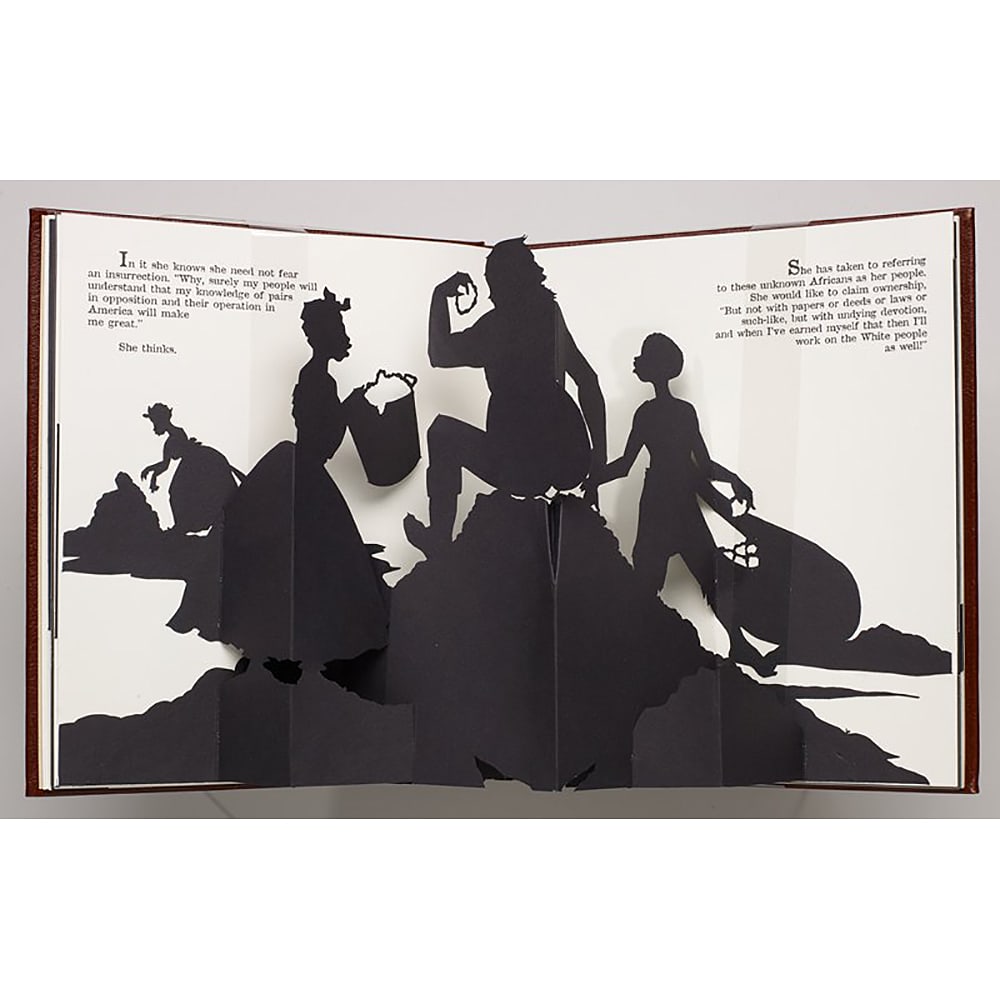 Kara Walker, Freedom, A Fable: A Curious Interpretation of the Wit of a Negress in Troubled Times: This pop up art book features Walker's biting silhouettes, foregrounding the historic enslavement and mistreatment of Black women. Kara Walker's cut-paper silhouette images, a technique quite popular
