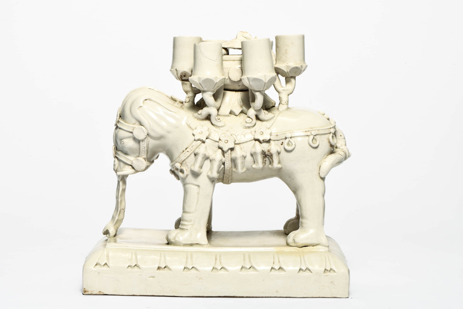 A WHITE-GLAZED ELEPHANT-BODIED SIX-HOLE INCENSE HOLDER: A WHITE-GLAZED ELEPHANT-BODIED SIX-HOLE INCENSE HOLDER Description: Length: 23cm Width: 14cm Height: 21cm