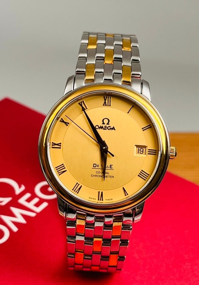 OMEGA DE VILLE COLLECTION WRISTWATCH: OMEGA DE VILLE COLLECTION WRISTWATCH Omega De Ville Wristwatch, Ref. 4374.11.00. Unworn and accompanied by the complete original set. Powered by the Omega Calibre 2500 Co-Axial automatic movement