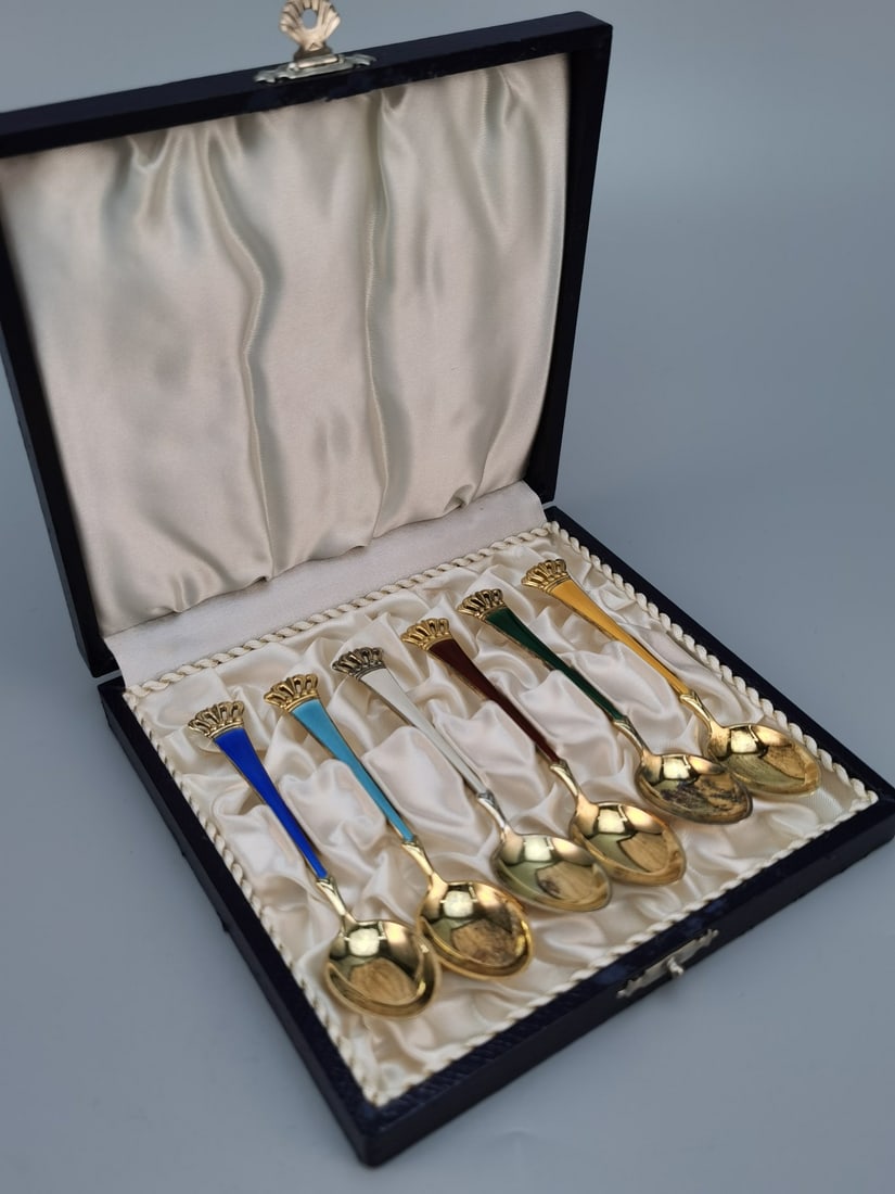DANISH STERLING SILVER, GILT, AND GUILLOCHé ENAMEL CROWN-FORM COFFEE OR PASTRY SPOON, CIRCA: DANISH STERLING SILVER, GILT, AND GUILLOCHé ENAMEL CROWN-FORM COFFEE OR PASTRY SPOON, CIRCA 1950S–1960S Danish Sterling Silver, Gilt, and Enamel Crown-Handled Spoon Set, circa 1960s. A set of six
