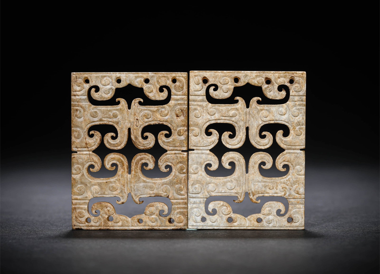 A PAIR OF JADE 'PLAQUE' PENDANTS: A PAIR OF JADE 'PLAQUE' PENDANTS Dimensions: Width: 4.1 cm (1.6 in.), Height: 5.1 cm (2.0 in.). All measurements are approximate.