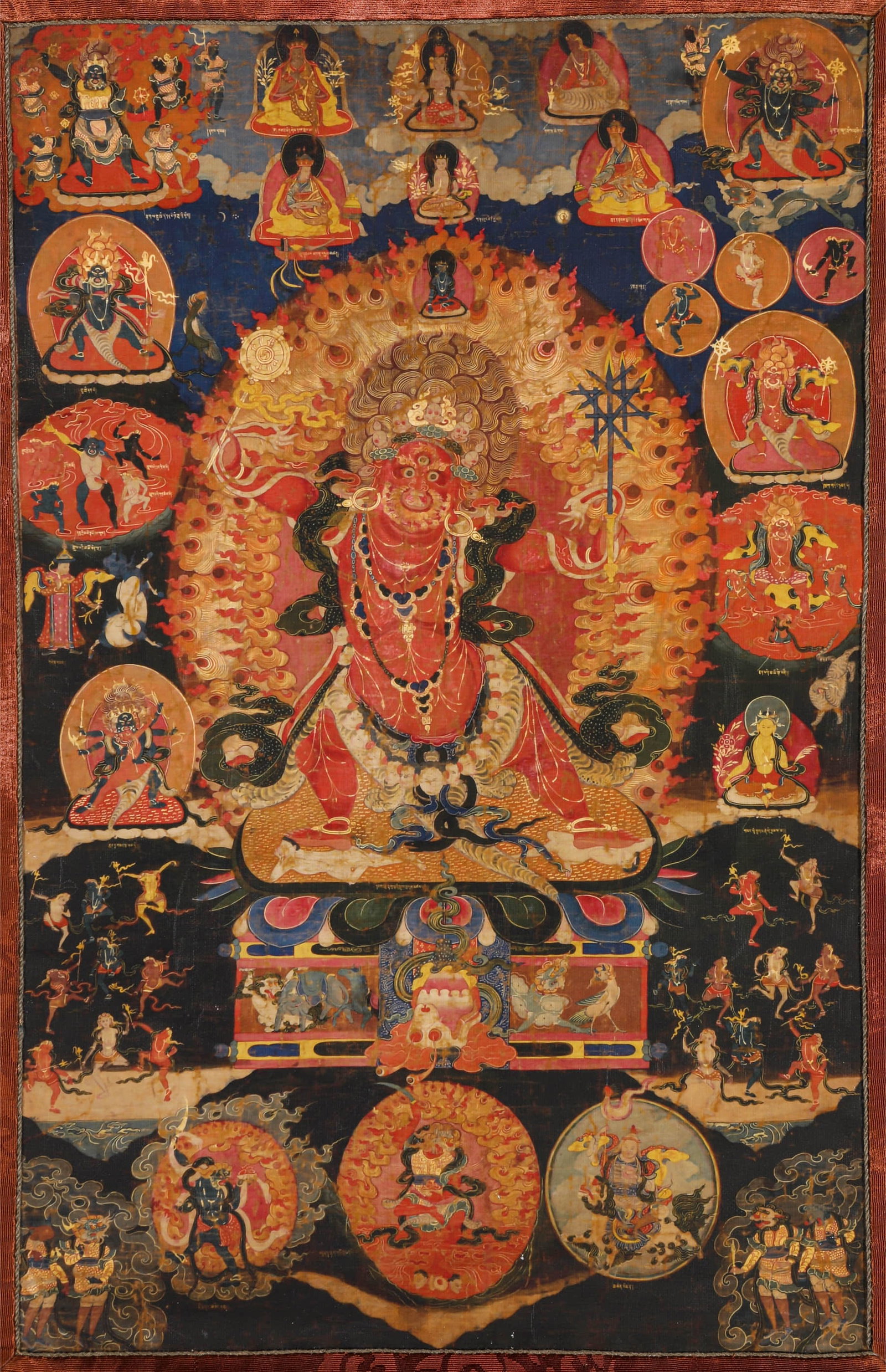 A THANGKA 'RED DHARMAPALA': A THANGKA 'RED DHARMAPALA' Dimensions: Width: 27 cm (10.6 in.), Height: 42 cm (16.5 in.). All measurements are approximate.