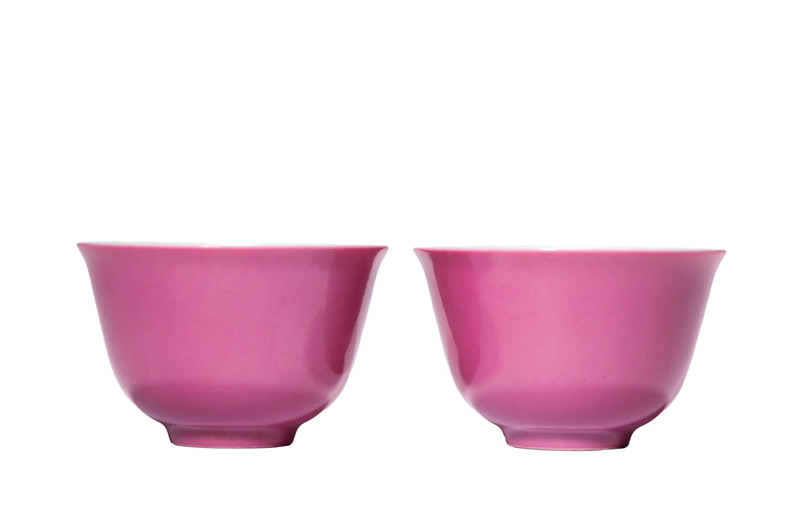 A PAIR OF RUBY-RED GLAZED 'PLAIN' CUPS: A PAIR OF RUBY-RED GLAZED 'PLAIN' CUPS Dimensions: Width: 7.3 cm (2.9 in.), Height: 5 cm (2.0 in.). All measurements are approximate.