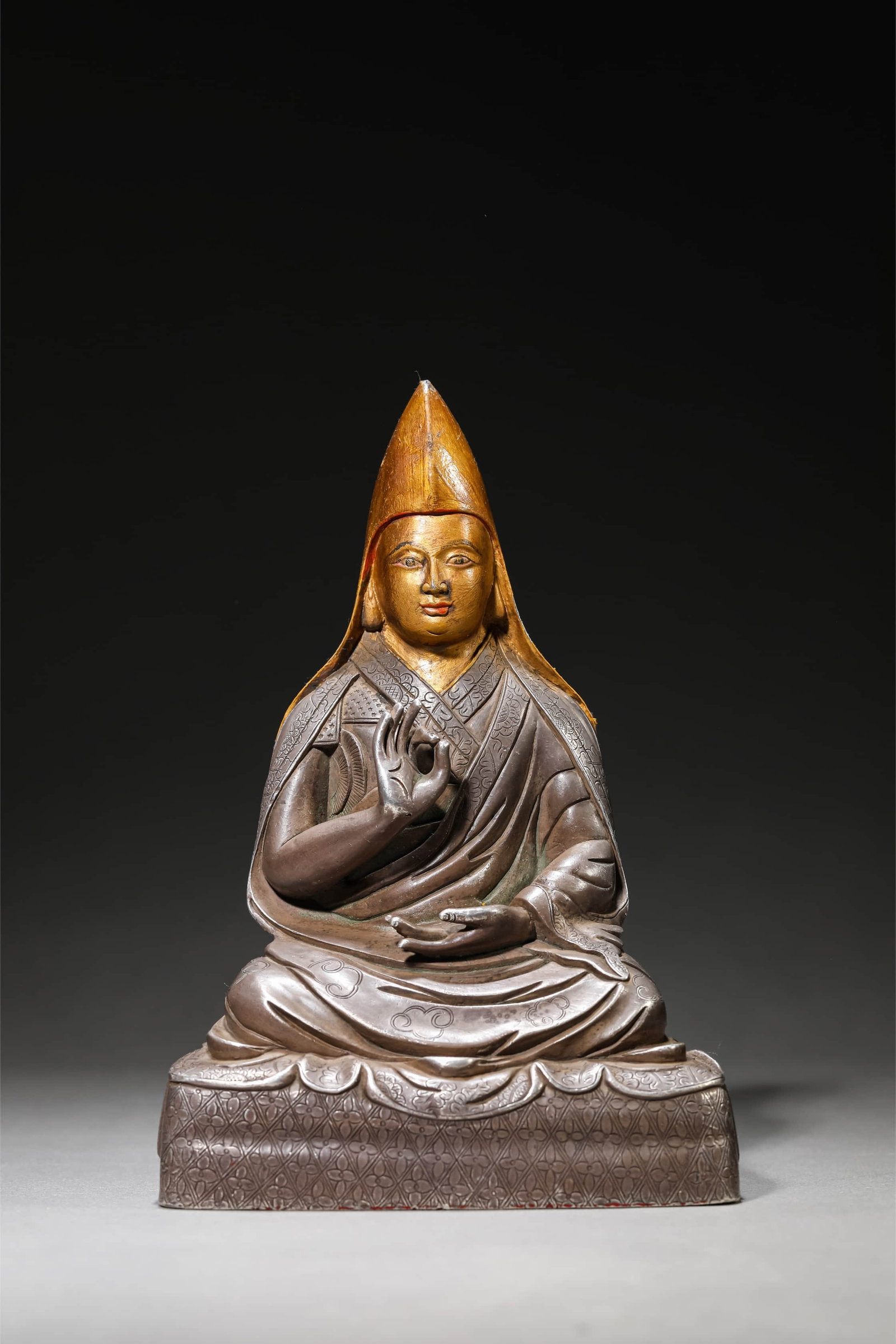 A PURE SILVER 'NINTH PANCHEN' FIGURE: A PURE SILVER 'NINTH PANCHEN' FIGURE Dimensions: Weight: 1,621 g. Length: 13.1 cm (5.2 in.), Width: 9.2 cm (3.6 in.), Height: 19 cm (7.5 in.). All measurements are approximate.