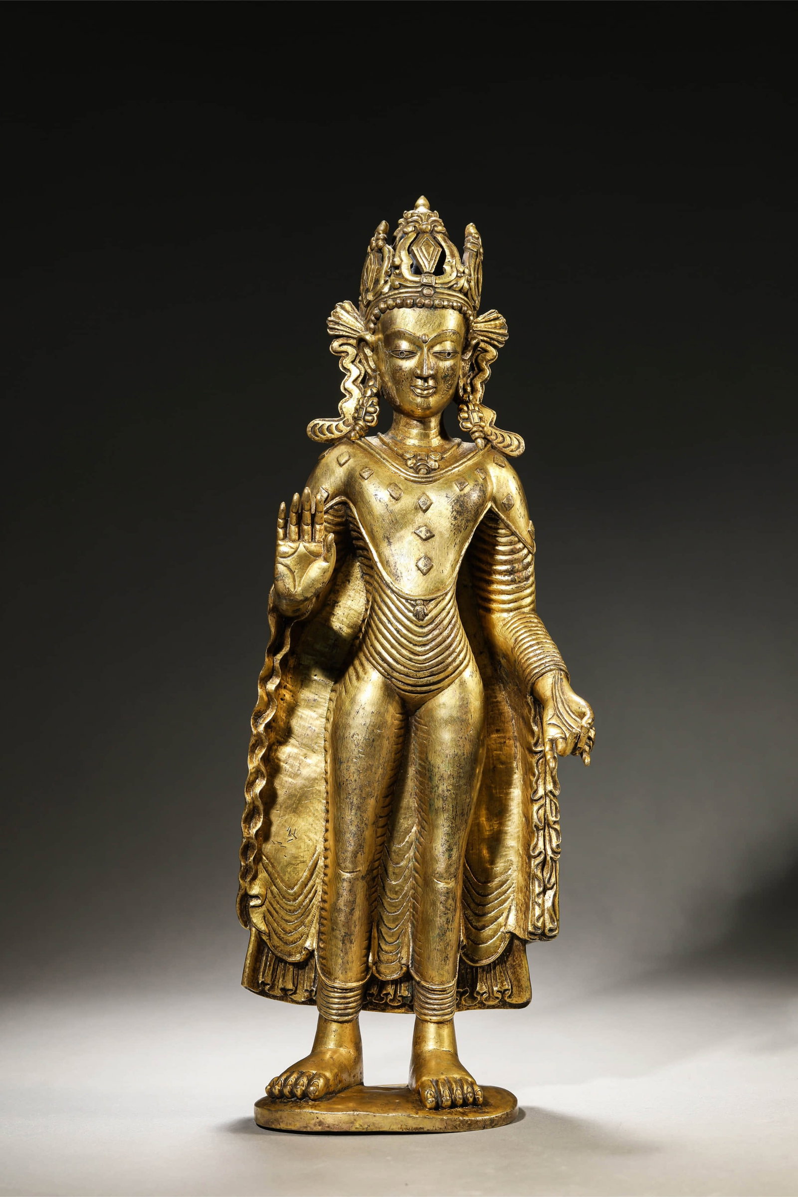 A 'SAKYAMUNI' BUDDHA FIGURE: A 'SAKYAMUNI' BUDDHA FIGURE Dimensions: Weight: 4.45 kg. Length: 14 cm (5.5 in.), Width: 8 cm (3.1 in.), Height: 37.4 cm (14.7 in.). All measurements are approximate.