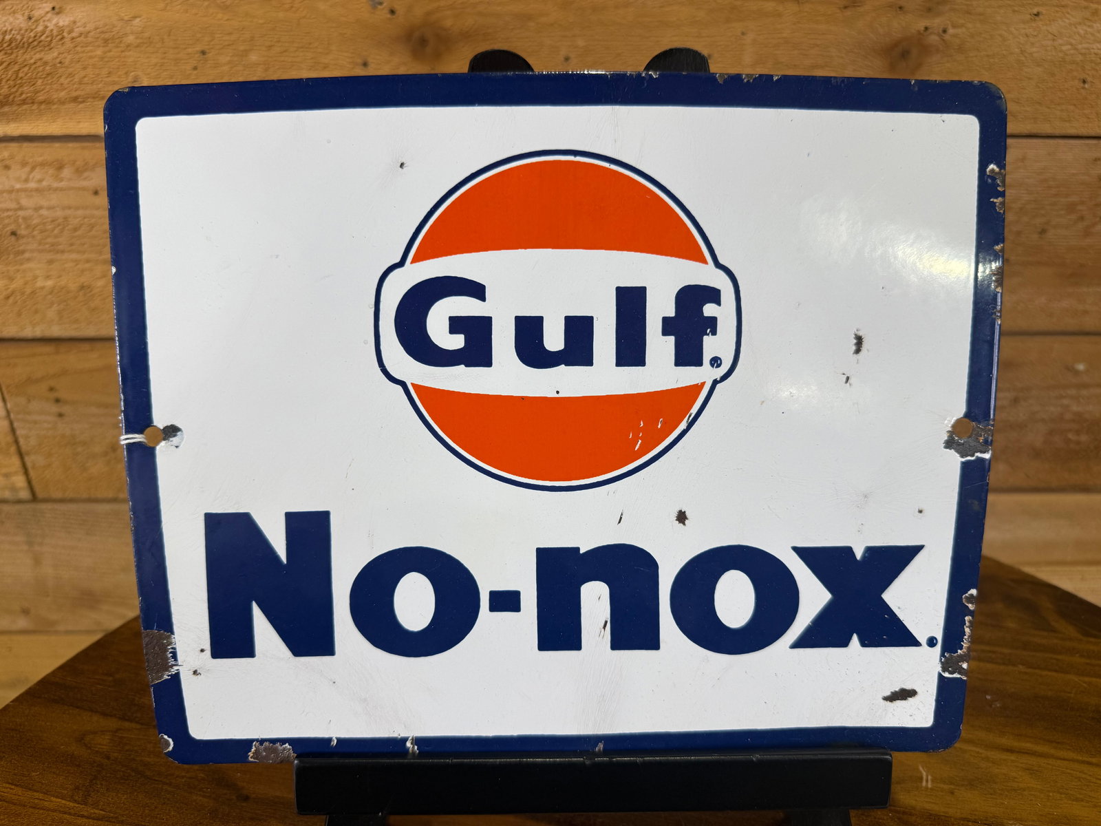 Original Single Sided Porcelain Gulf No-Nox Pump Sign: The sign has good overall color but moderate gloss fading. Good condition with minor wear and chipping around the perimeter and mounting holes; display-ready.