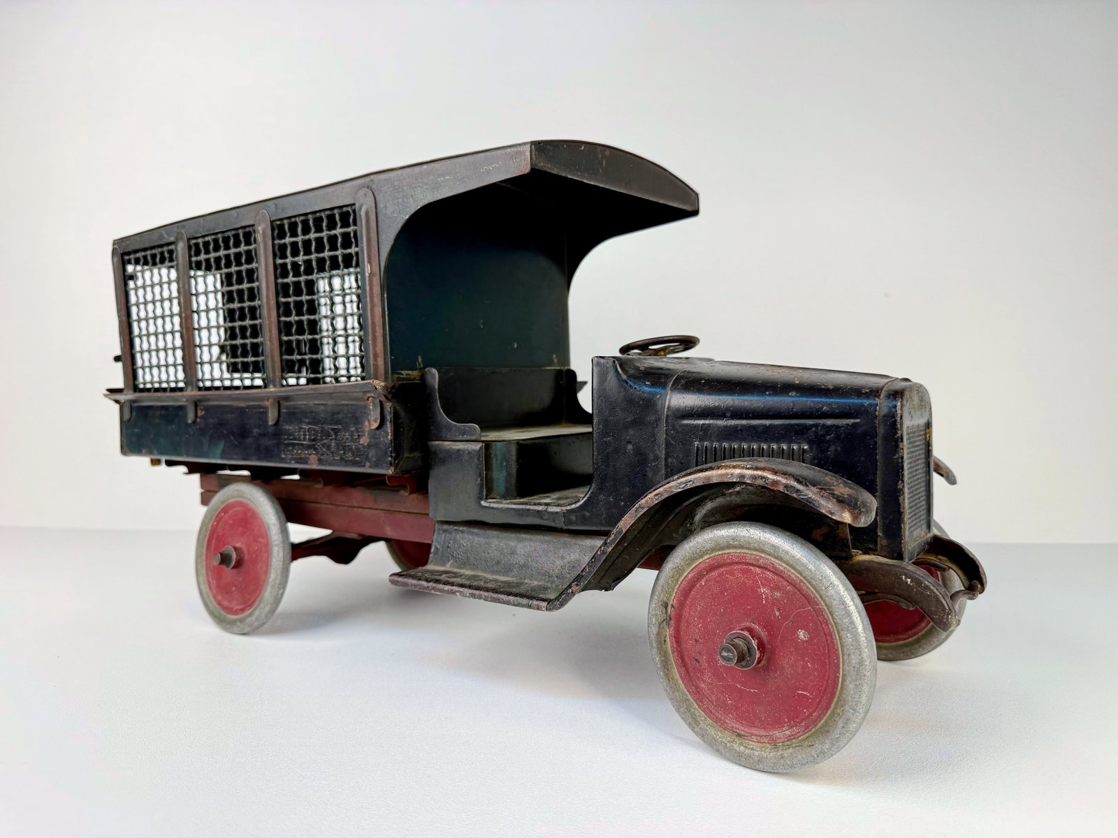 1920's Buddy L Railway Express Truck: Buddy L Railway Express Truck, East Moline, Illinois, circa 1920s. Pressed steel construction featuring the original rear gate and one original rear cargo door. Exhibits honest wear, fading, and age-r