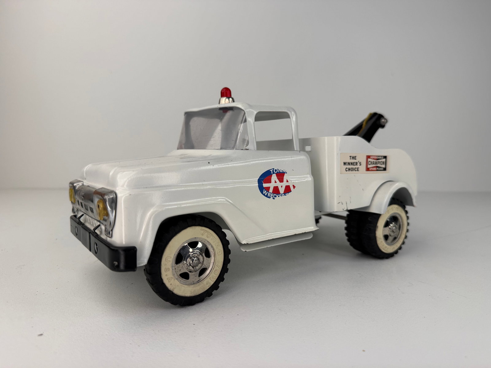 Tonka AA Wrecker Tow Truck Toy: 1950s Tonka AA Wrecker Tow Truck featuring a beautiful repaint and working tow crane. A classic pressed steel Tonka toy with excellent color, display appeal, and collector value. A great addition to a