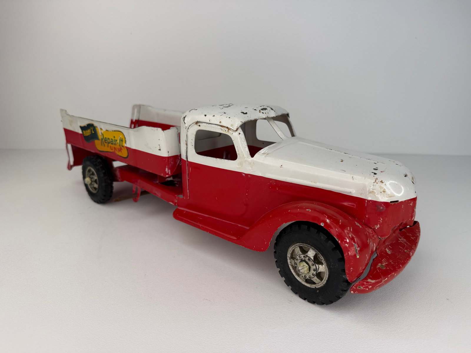 Buddy L Repair-It Unit pressed steel tow truck: Buddy L Repair-It Unit Pressed Steel Tow Truck, dating to the 1940s or early 1950s. An all-original example retaining good paint and original decals. Missing the original jack but otherwise a solid vi