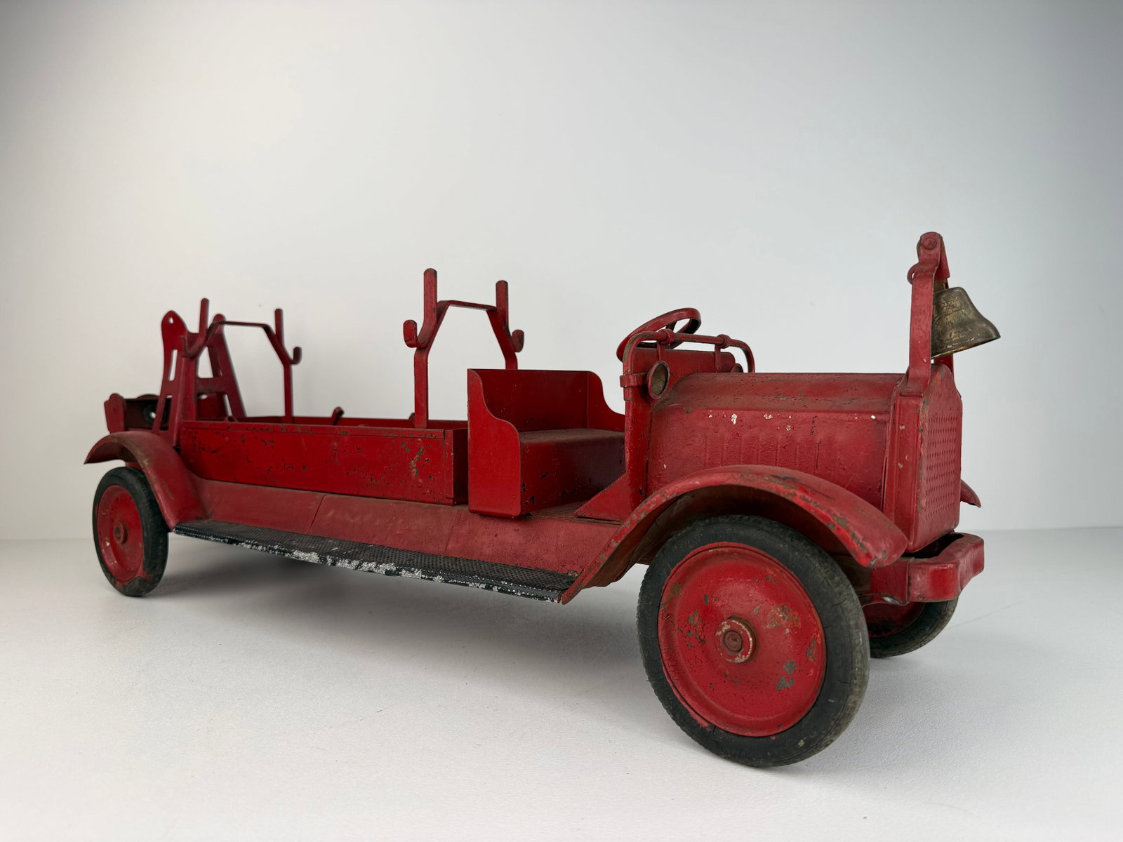 1920s-30s Buddy L pressed steel fire engine: 1920s Buddy L Pressed Steel Aerial Extension Ladder Fire Truck in good overall condition. Retains its original brass bell but is missing the ladder and a few other components. A desirable early Buddy 