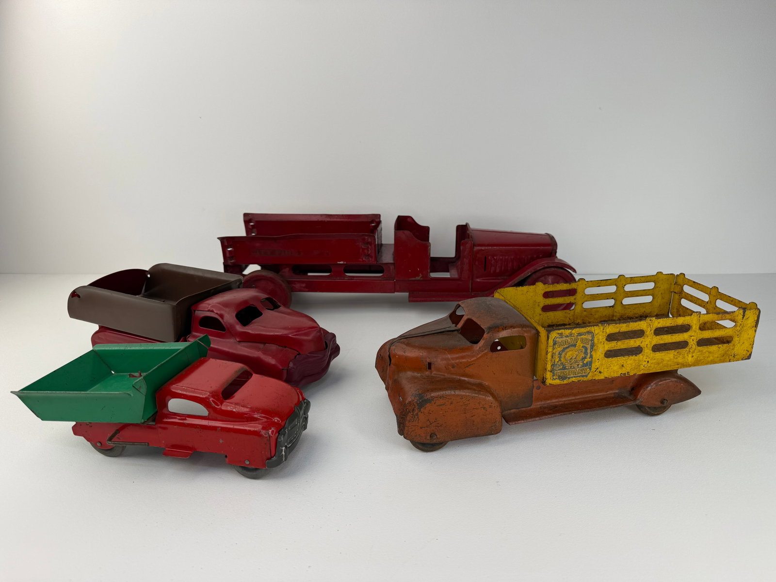 Lot of four repainted pressed steel trucks (1 of 9)