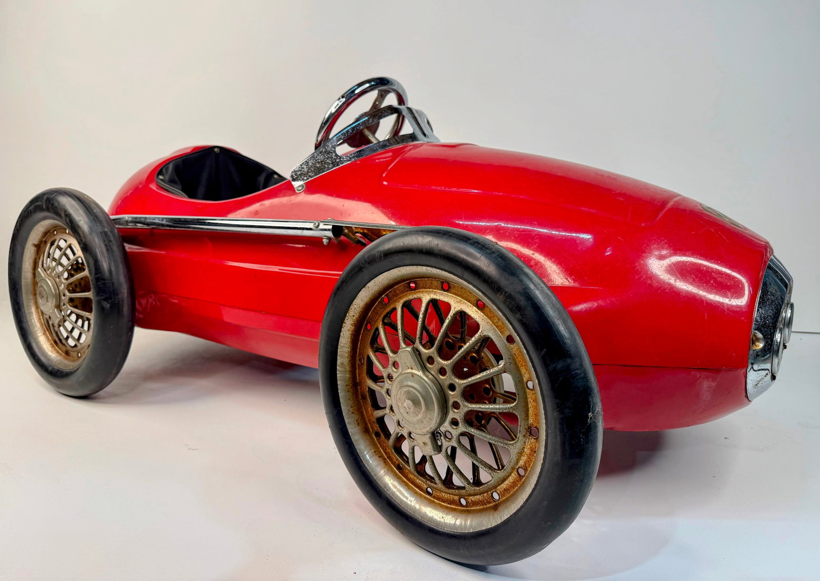 American Retro Giordani Ferrari Racer Pedal Car: American Retro Giordani Ferrari Racer Pedal Car styled after the iconic 1950s Grand Prix race cars. Finished in vibrant red and equipped with chrome wheels featuring knock-off spinners, a chrome steer