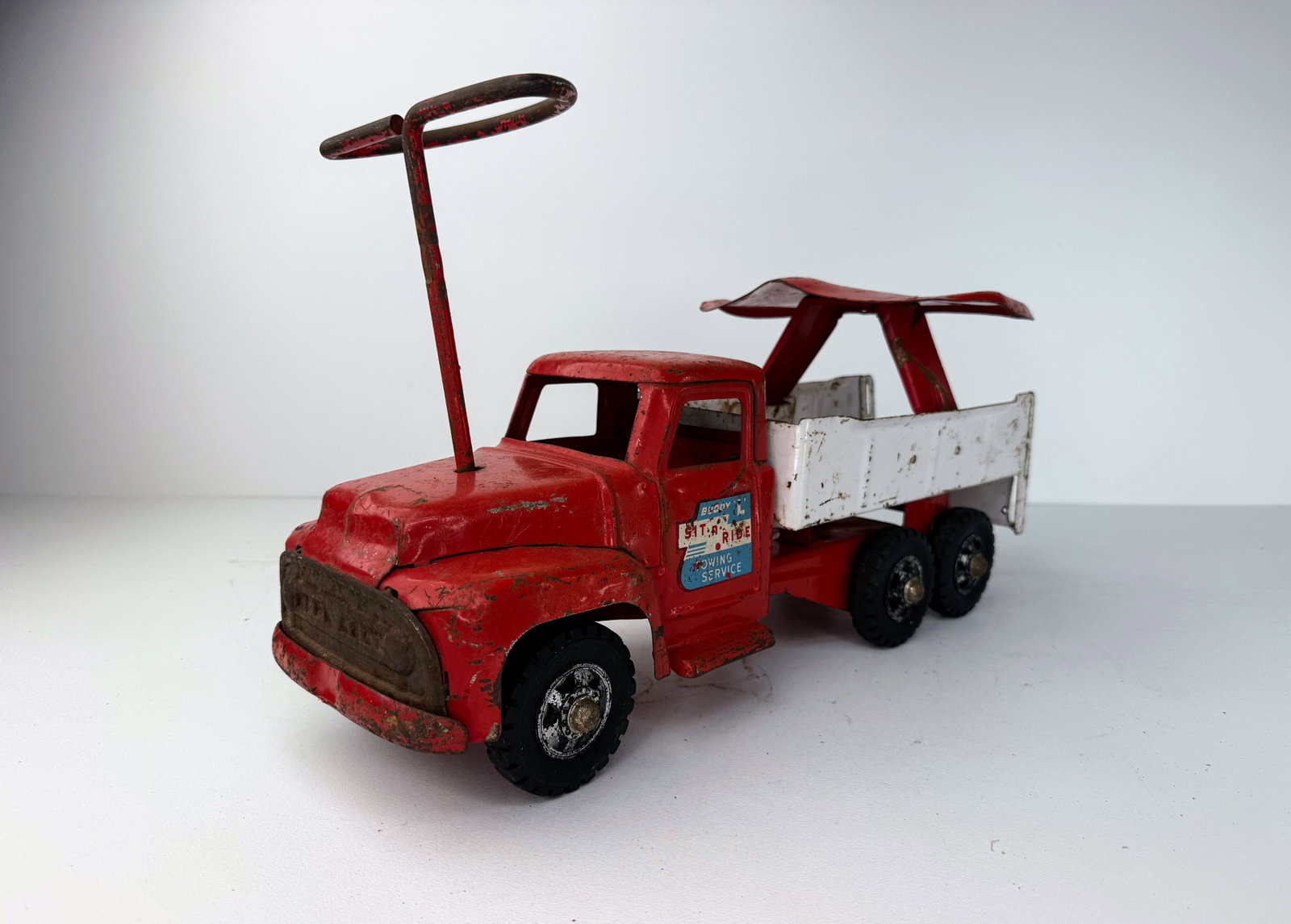 Mid-twentieth century Buddy-L sit-N-ride truck with seat (1 of 7)