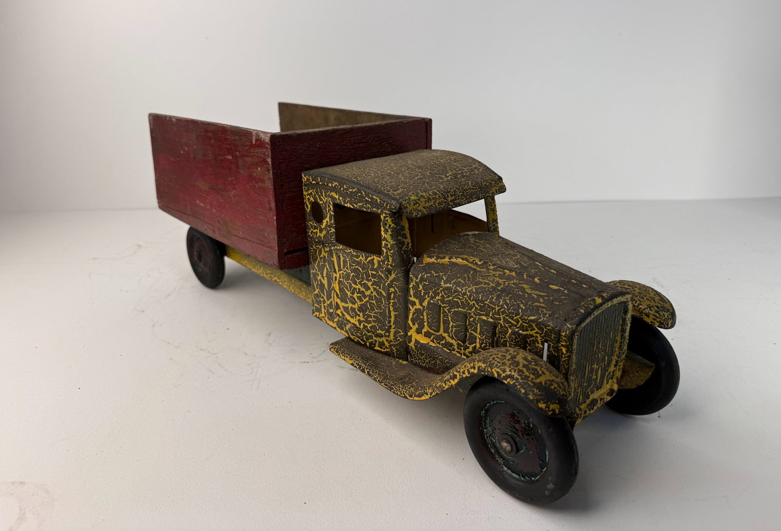 Pressed Steel keystone Dump Truck: Pressed Steel Keystone dump truck. A great vintage pressed steel truck featuring a replacement wooden dump bed that adds a unique rustic character. A wonderful display piece for any vintage toy