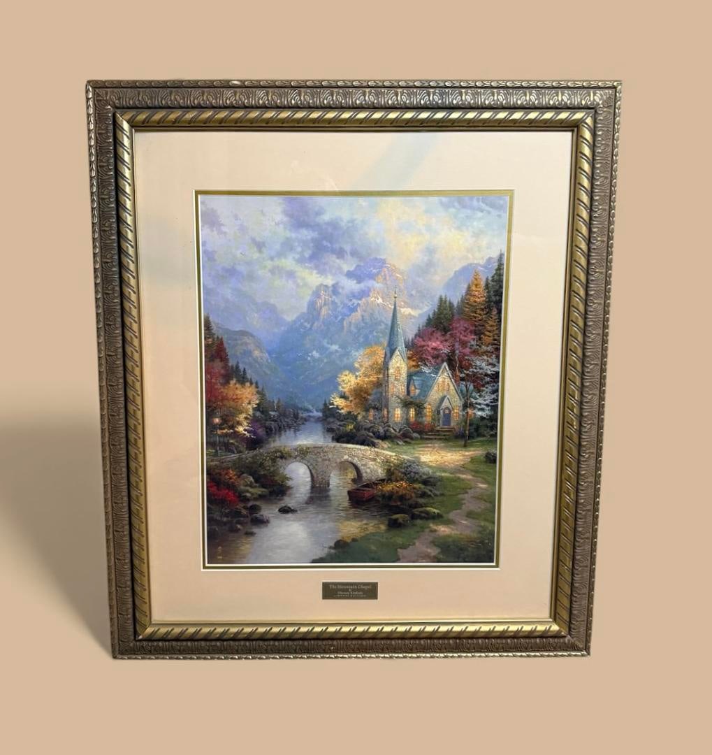 The Mountain Chapel By Thomas Kinkade LIBRARY EDITION Limited Edition Lithograph Museum Quality: 185 "The Mountain Chapel" By Thomas Kinkade LIBRARY EDITION 30.5"X26"; Professionally Matted and Framed with UV resistant Glass and acid free materials, Museum quality framing, and placard. COA Includ