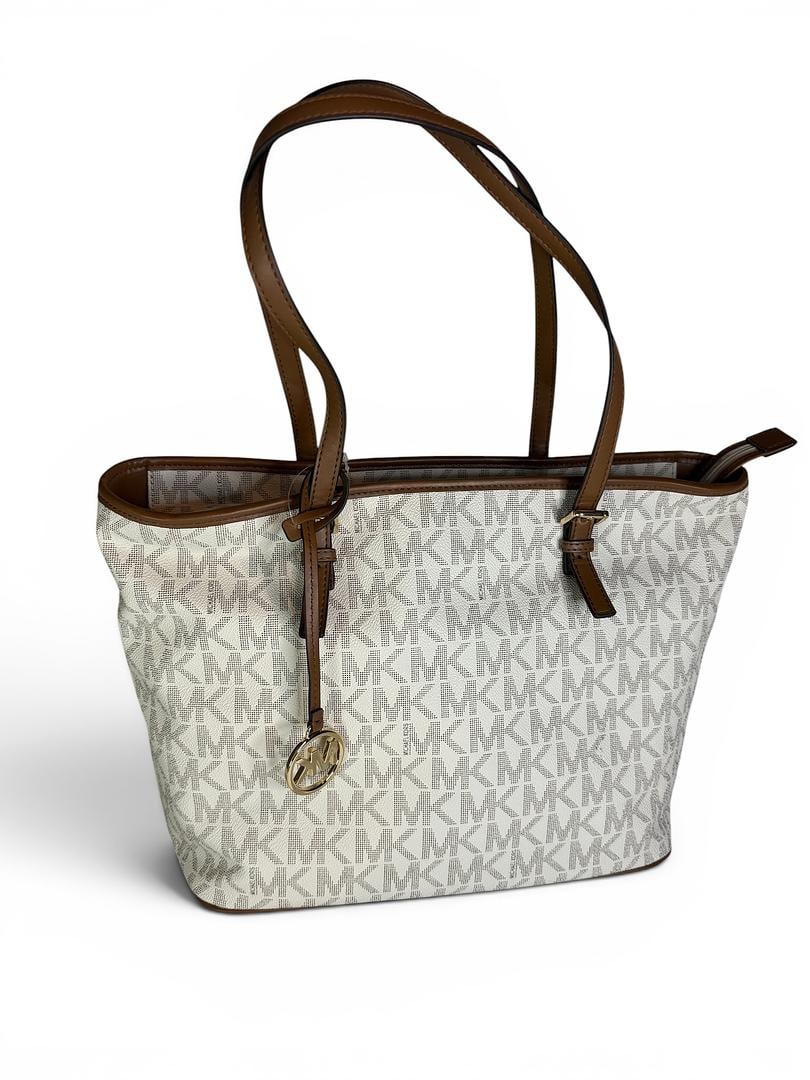 Michael Kors JET SET Vanilla Luggage Handbag Brand new with Tags MSRP 298 USD Tote Bag: Michael Kors; JET SET; Vanilla Luggage MSRP $298.00 NWOT SKU 196237382900; Tote Bag MK