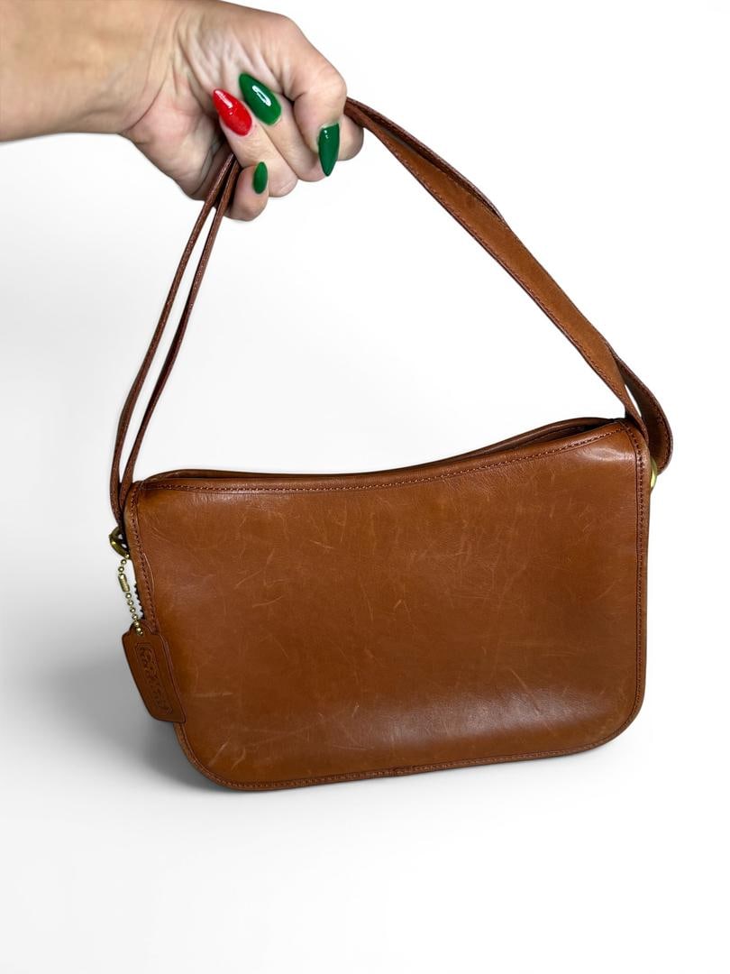 COACH Vintage Coach Taylor Zip Crossbody Bag 1994 Mahogany and Brass Like New Condition Shoulder: LOT 71 COACH; Vintage Coach Taylor Zip Crossbody Bag 1994 Mahogany and Brass Style# 101-14; 11” (L) x 7 ½ (H) x 2” (W);Condition: Like New; Included: Bag Charm, Shoulder Strap; Valu