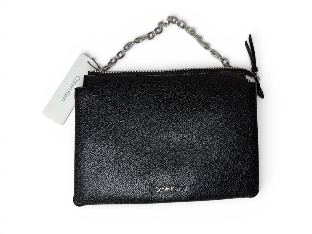Calvin Klein Black and Silver Convertible Shoulder Bag Black Pebble Leather Chain Strap Optional: LOT 93 Calvin Klein; Style# H4AEYSL3 Black/Silver Convertible Shoulder Bag Black Pebble Leather Chain Strap, Optional Coin Purse and Canvas Shoulder Strap Add Ons NWOT MSRP $168.00 UPC 197383529683; I