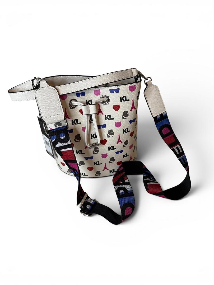 Karl Lagerfeld Multi White Maybelle Large Bucket Crossbody Bag Canvas Crossbody Shoulder Strap: LOT 99 Karl Lagerfeld; Style# LH1E46AQ Multi-White Maybelle Large Bucket Crossbody Bag UPC 194775467219 MSRP $178.00 Included: Canvas Crossbody Shoulder Strap