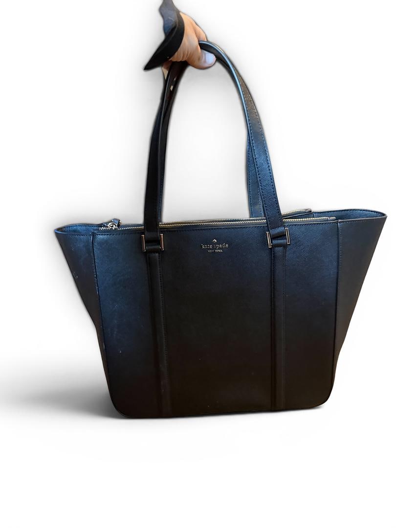 Kate Spade Style Womens Black Saffiono Leather Newbury Lane HandBag MSRP 478 USD Included Care Card: LOT 109 Kate Spade; Style# WKRU7109 Women’s Black Saffiono Leather Newbury Lane HandBag NWOT MSRP $478 UPC 767883699393; Included: Care Card, Shoulder Strap (Leather/Chain)