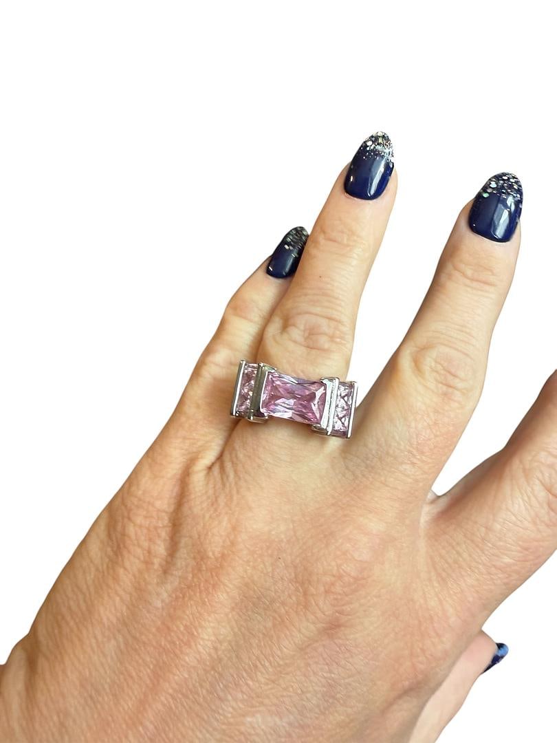 Womens Sterling Silver Pink Topaz Gemstones Fashion Ring with 8 Pink Princess Cut CZ Stones: LOT 117 Womens Sterling Silver Pink Topaz Gemstones Fashion Ring with 8 Pink Princess Cut CZ Stones Accenting the Large Pink CZ Center Pink CZ Gemstone Size 7.5 total weight 11 Grams
