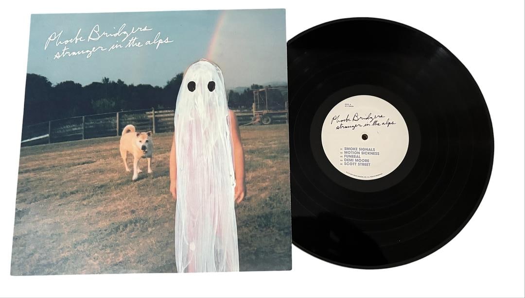Phoebe Bridgers Stranger In The Alps LP Vinyl Record: LOT 47ARTIST: Phoebe BridgersTITLE: Stranger In The AlpsRELEASED: 2017; CATALOG # DOC142FORMAT: Vinyl 12"GENRE: Rock, Folk, World, & CountryTRACK LIST: A1. Smoke SignalsA2. Motion SicknessA3. FuneralA