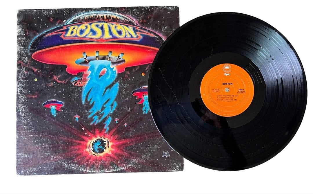 Boston Self Titled 1976 Vinyl Record LP: LOT 123ARTIST: BostonTITLE: BostonRELEASED: 1976CATALOG #: PE 34188FORMAT: Vinyl 12"GENRE: RockTRACK LIST:A1. More Than A Feeling (4:44)A2. Peace Of Mind (4:55)A3. Foreplay/Long Time (7:56)B1. Rock & 
