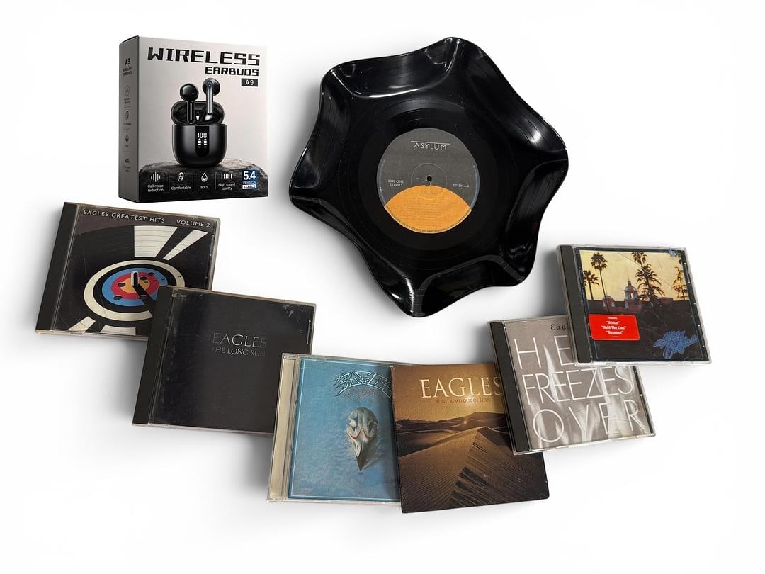 Eagles Music Lovers Gift Bundle CDs Earbuds Vinyl Record Bowl Decor Guitar Picks: EAGLES Lot comes with everything you see in photo. Lot comes with a mystery assortment of 5 random guitar picks. Lot includes Upcycled Record Trinket bowl/wall decor Warped Record Decor you see pictur