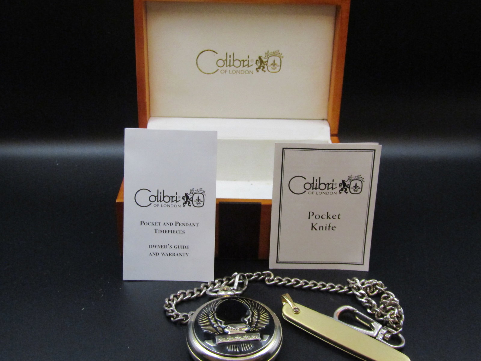 Colibri of London Pocket Watch and Pocket Knife, with Box and COA's: Colibri of London Pocket Watch and Pocket Knife, with Box and COA's Condition Yes, we will ship this item, we provide in house shipping to save our customers money. S&H fees and insurance will be adde