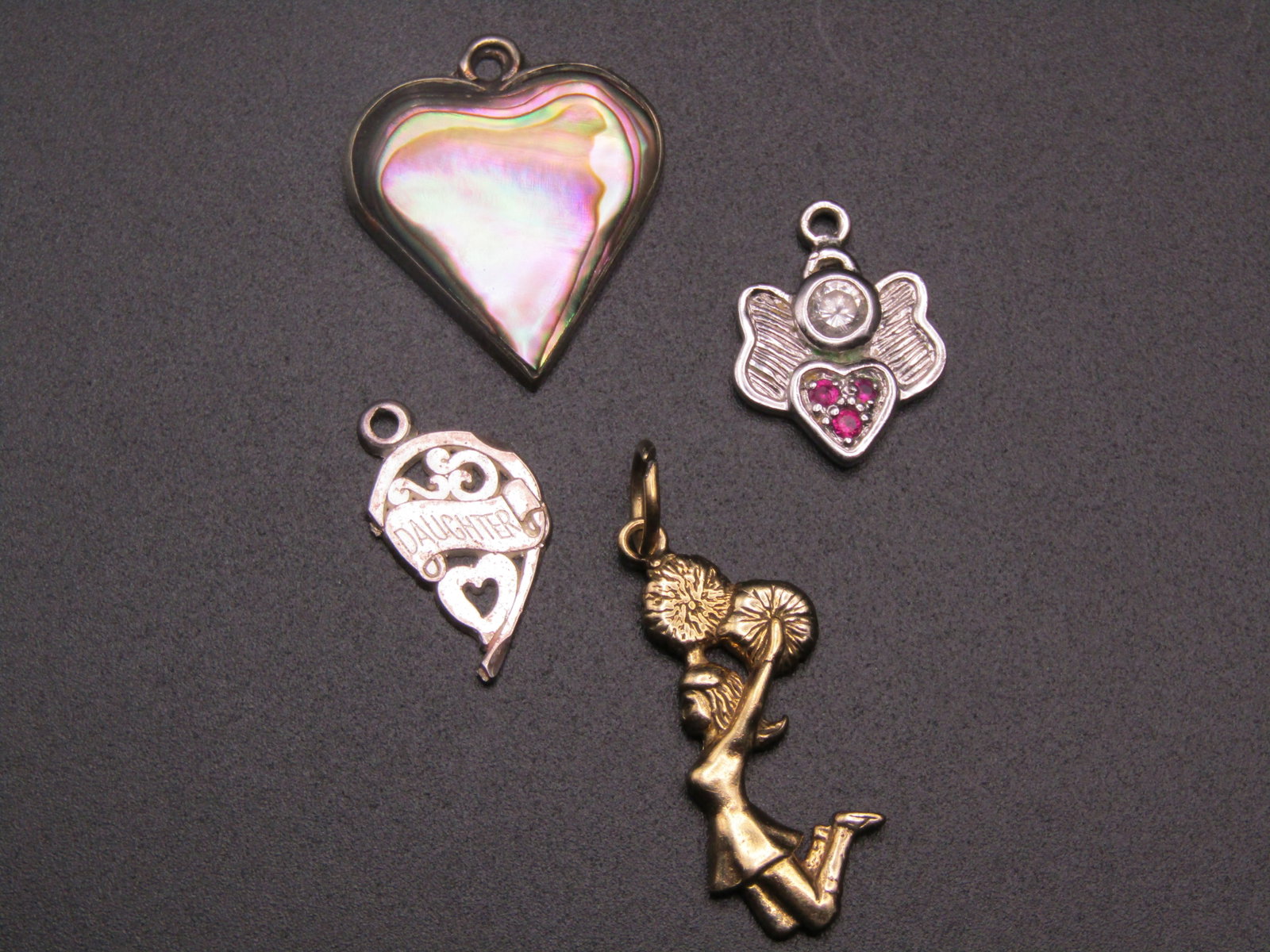 Lot Of 4 Sterling Silver Pendants: Cheerleader, Heart Marked 'Mexico', Angel, Daughter Half Heart: Lot Of 4 Sterling Silver Pendants: Cheerleader, Heart Marked "Mexico", Angel, Daughter Half Heart Condition Yes, we will ship this item, we provide in house shipping to save our customers money. S&H f