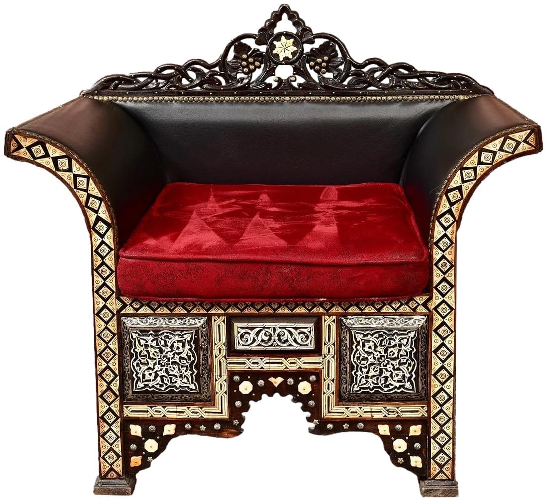 Moroccan Inlaid Accent Chair With Suede Cushion: Dimensions: 34 1/2”H x 36 1/2”W x 25 1/4”D - Floor to seat: 18 1/2”H Exotic Moroccan chair featuring a carved crest rail and geometric and foliate inlay, arched apron and a red