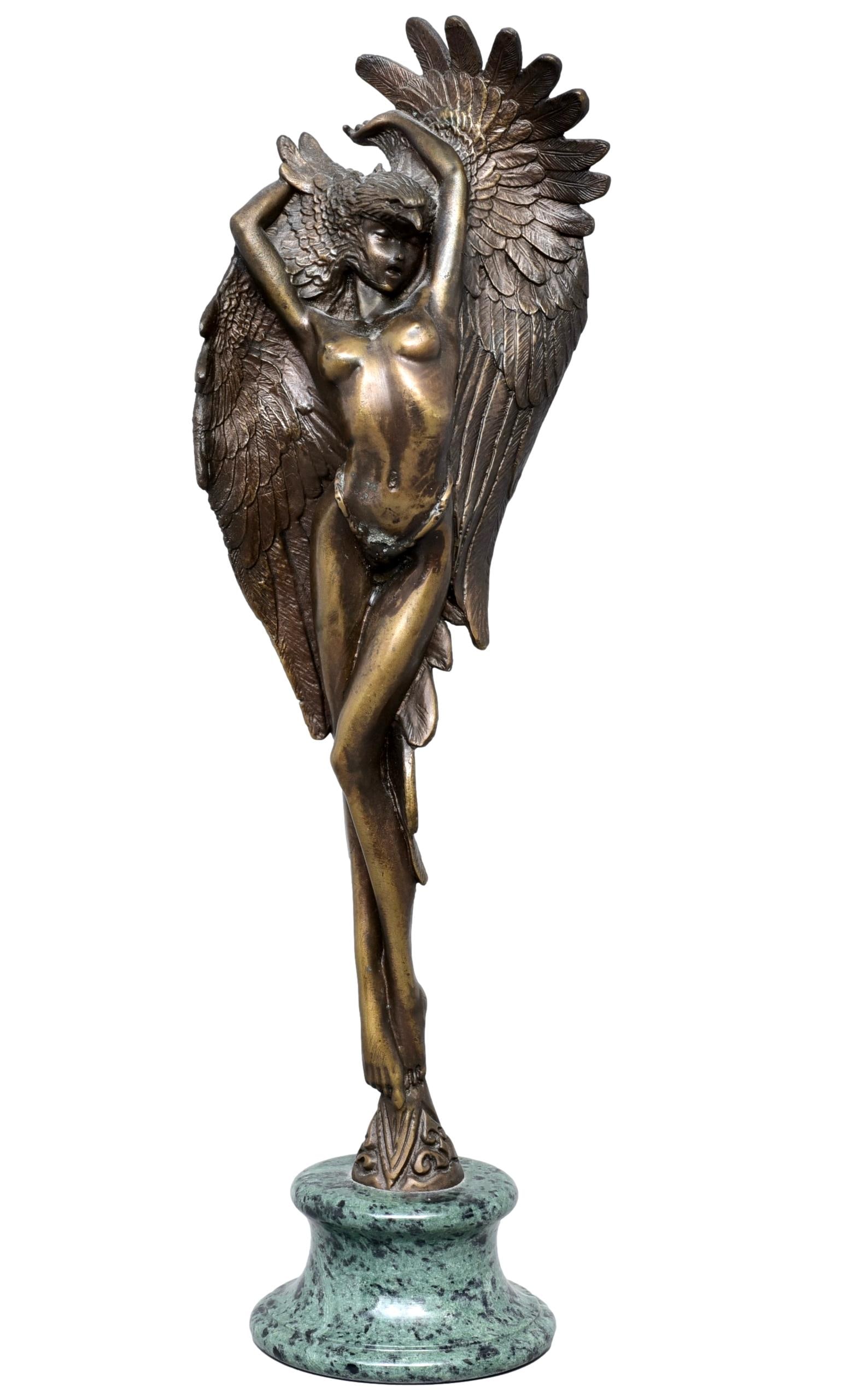 Cast Bronze Standing Female Nude Sculpture Wearing Eagle Headdress: Dimensions: 4 1/4”W x 15”H" Figurine sits on a marble base. Unsigned. The Arts Auction House offers local delivery to Manhattan, Connecticut and Westchester for most items excluding very l