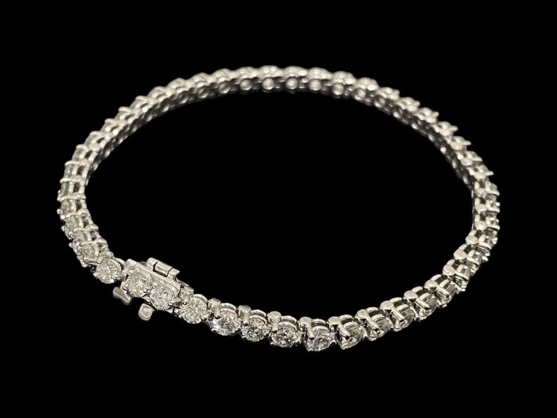 Over 5 TCW Dazzling Diamond Tennis Bracelet: 14K White Gold: Condition: Like New Brand: Unbranded Material: 14k White Gold Jewel: Diamond Diamond Type: Round Brilliant Cut Diamonds Diamond Count: 46 Total Carat Weight: Over 5 CTW Setting Type: Prong Diamond Dim