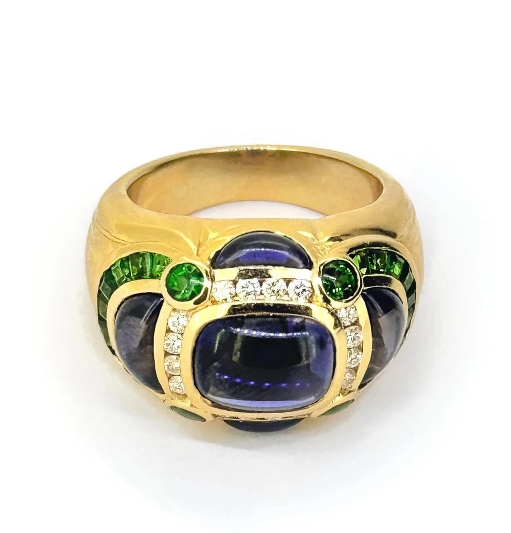 Robert Wander Winc Solid 18k Gold Cabochon Cut Sapphire Diamond & Tsavorite Ring: Condition: Gently Pre owned, Excellent Brand: Robert Wander Winc Material: 18K yellow gold Stones: Sapphire, Tsavorite & Diamonds Diamonds: 16 round brilliant-cut Sapphires: 5 Tsavorites: 22 Ring size