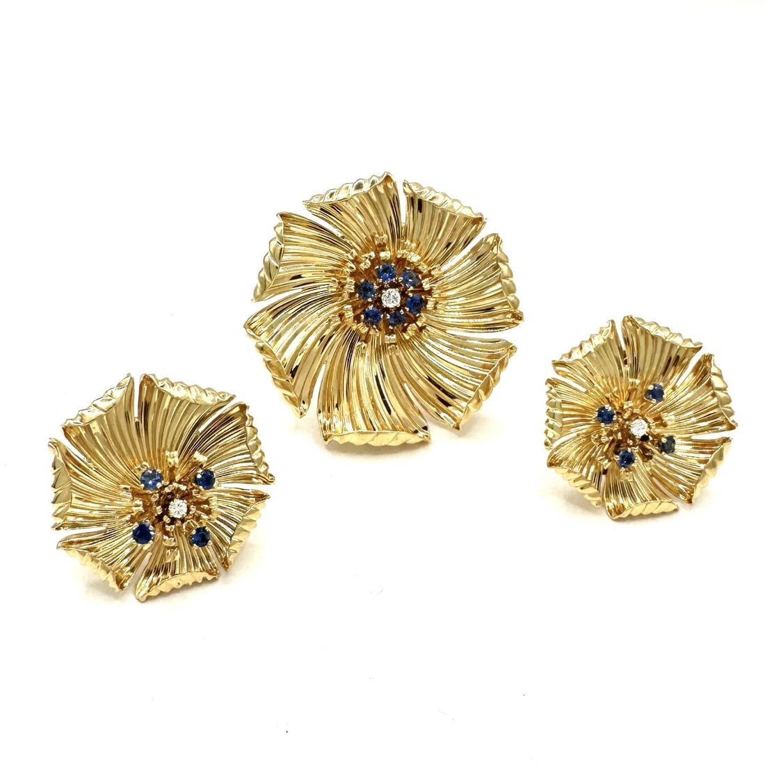 Tiffany & Co. 14k Gold Diamond & Sapphire Dogwood Flower Set, Earrings & Brooch: This Vintage, Elegant Tiffany & Co. Set of Earrings & Pin Brooch, is a stunning example of beauty and nature. Crafted from 14k yellow gold, they feature a charming dogwood flower design with sparkling