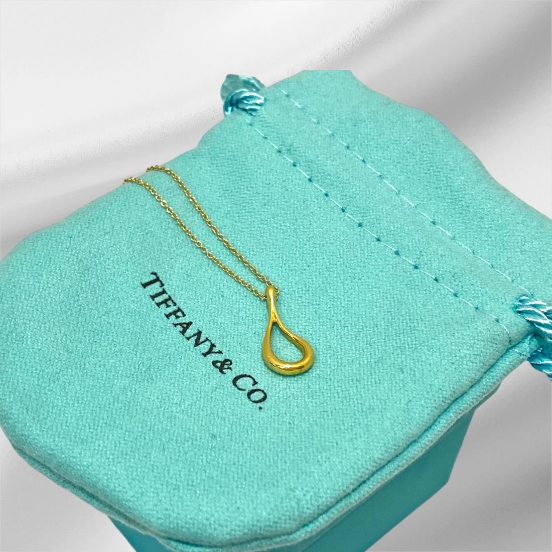 Tiffany & Co. by Elsa Peretti 18K Gold Open Teardrop Necklace Pendant (#143): Tiffany & Co. by Elsa Peretti 18K Gold Open Teardrop Necklace Pendant Item: Necklace / Pendant Brand: Tiffany & Co. (by Elsa Peretti) Material: 18K Yellow Gold. Pendant Dimensions: 17mm x 8mm Chain si