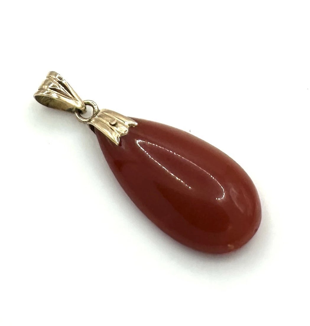 Natural Red Coral Teardrop Pendant / Charm With 14K Yellow Gold Bail (#148): Natural Red Coral Teardrop Pendant / Charm, With 14K Yellow Gold Bail Introducing a stunning Natural Gem Graded Coral Teardrop Pendant, crafted in elegant 14K yellow gold. This timeless piece features