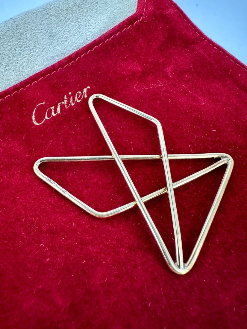 CARTIER Collectable Polygonal Butterfly Shaped Money Clip in 14k Yellow Gold: Item: Money Clip Brand: Cartier Material: 14k Yellow Gold Clip Dimensions: 2.1" x 1.6" inches. Hallmarks: CARTIER 14K. Total Weight: 11 grams. Condition: Excellent, Gently pre-owned, Polished