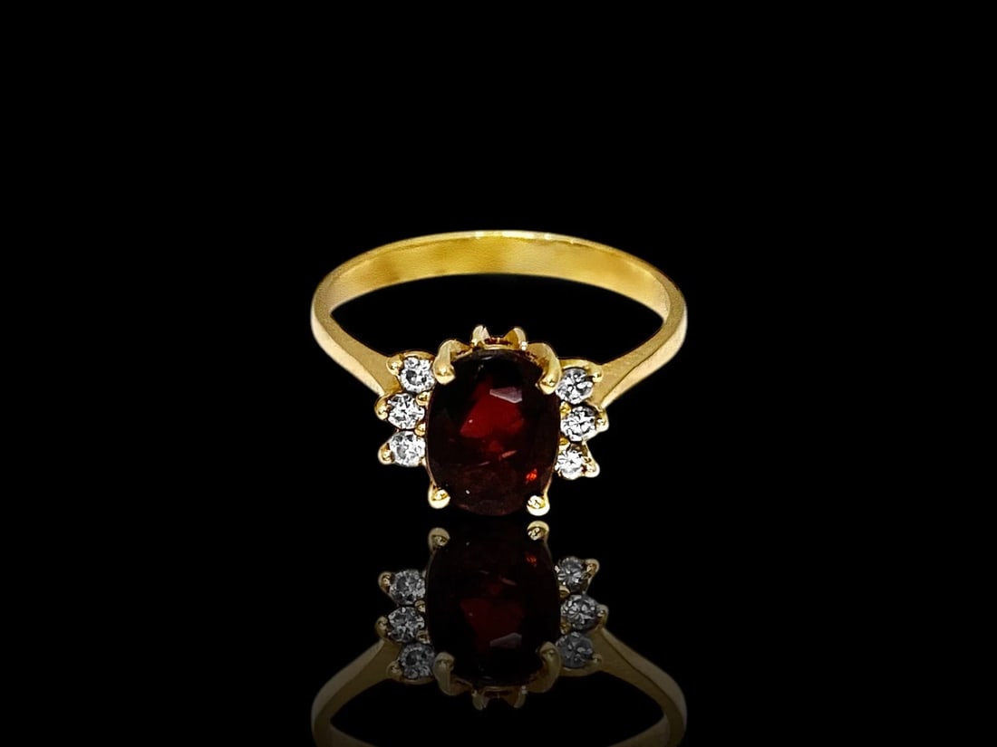 Estate 2ct Oval Garnet Diamond Ring in 14k Yellow Gold Size 9.25: Item: Ring Metal: 14k Yellow Gold Total weight: 3.4 grams GemStone: Oval-Cut Garnet & Diamonds Garnet Dimensions: 7mm x 9mm. (Approx. 2.0 CT) Diamond Count: 6 Natural Round Brilliant-Cut Stones. Ring