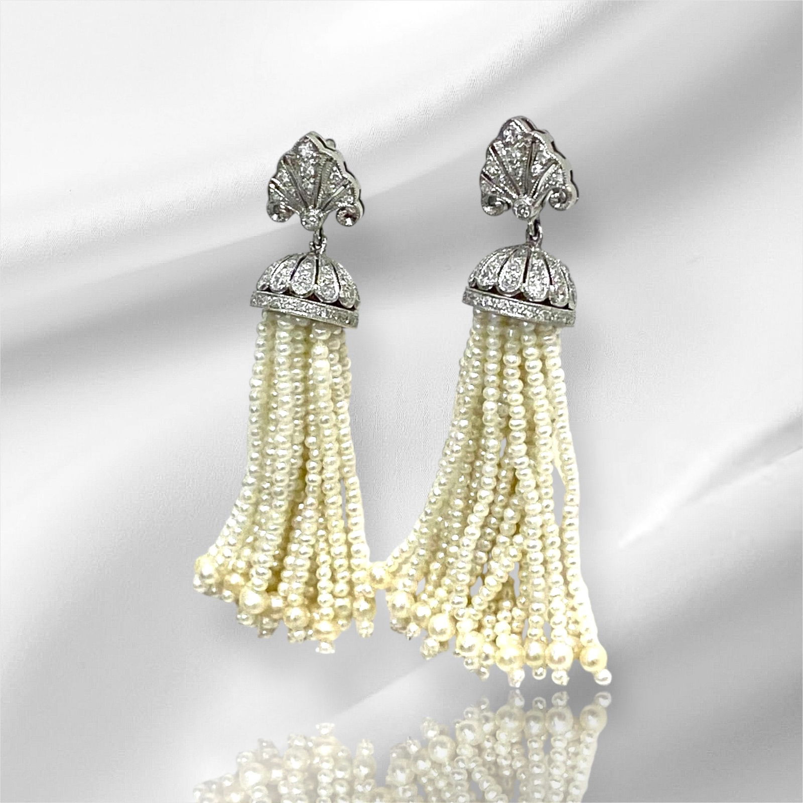 Art Deco Seed Pearl and Diamond Tassel Earrings in Platinum: Condition: Like New Brand: Unbranded Material: Platinum Jewel: Seed Pearls and Diamond. Round Diamond Count: 92 Diamond. Weight: 14 grams.