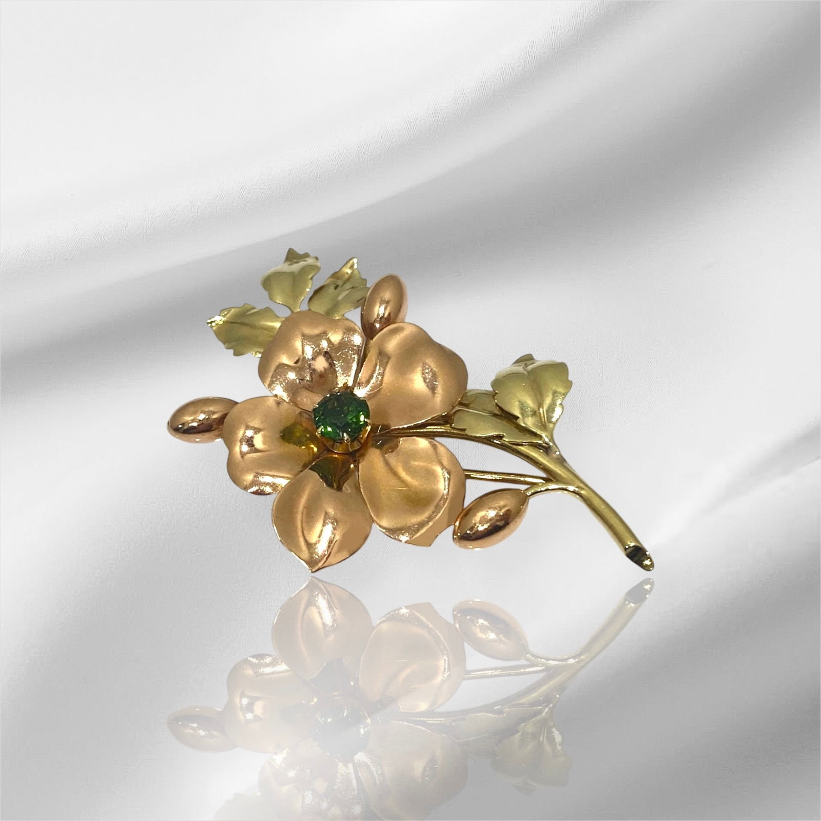 Signed Tiffany & Co. 14k Two Tone Gold Double Leaf Brooch with Green Tourmaline: Condition: Excellent Brand: Tiffany & Co. Type: Brooch Metal Purity: 14k Two Tone Gold GemStone: Green Tourmaline Brooch Dimensions: Length: 2.5"inch Width: 1.8" inch Stamp: "Tiffany & Co." Weight: 12