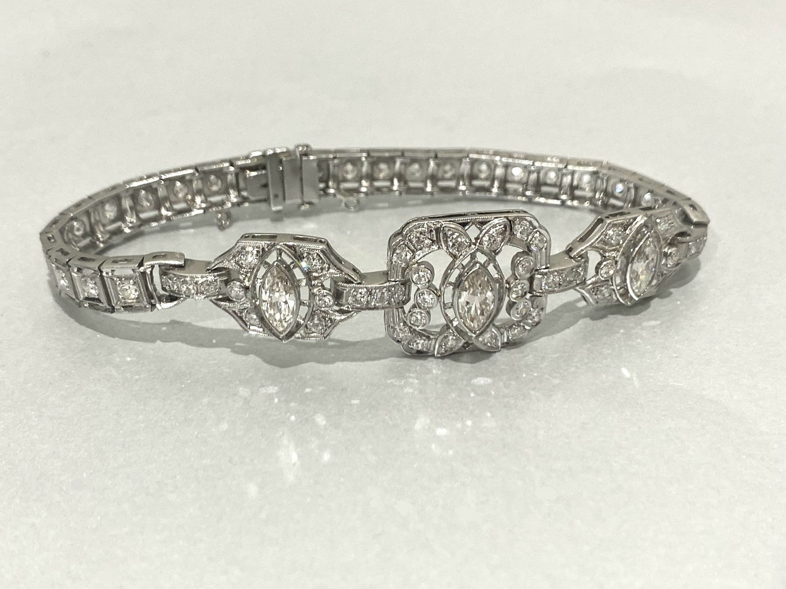 Over 3.2 CTW Art Deco Diamond Bracelet in Platinum: Condition: Excellent Metal: Platinum Total Diamond Count: 66 Round Brilliant cut And 3 Marquise cut GemStone: Diamond 2.25 CTW Marquise cut Marquise Diamond Clarity: VS1-VS2 Marquise Diamond Color: H-