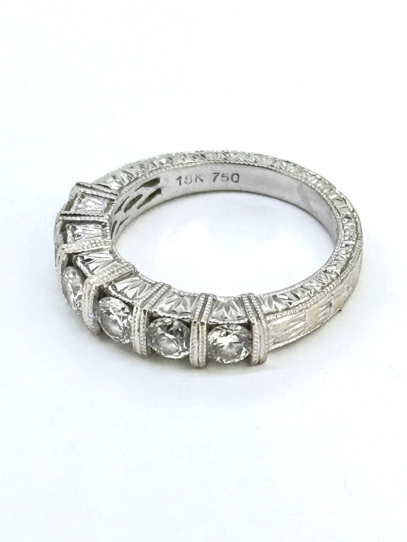 Art Deco 18k White Gold Tiered Diamond Wedding Band Ring: Condition: Like New. Brand: Unbranded. Material: 18k White Gold. Gemstone: 6 Round-cut Diamond Total Carat Weight: Apx 1 Carat Clarity & Color: VS1-VS2; F-G Ring Size: 3.75. Weight: 3.8 grams