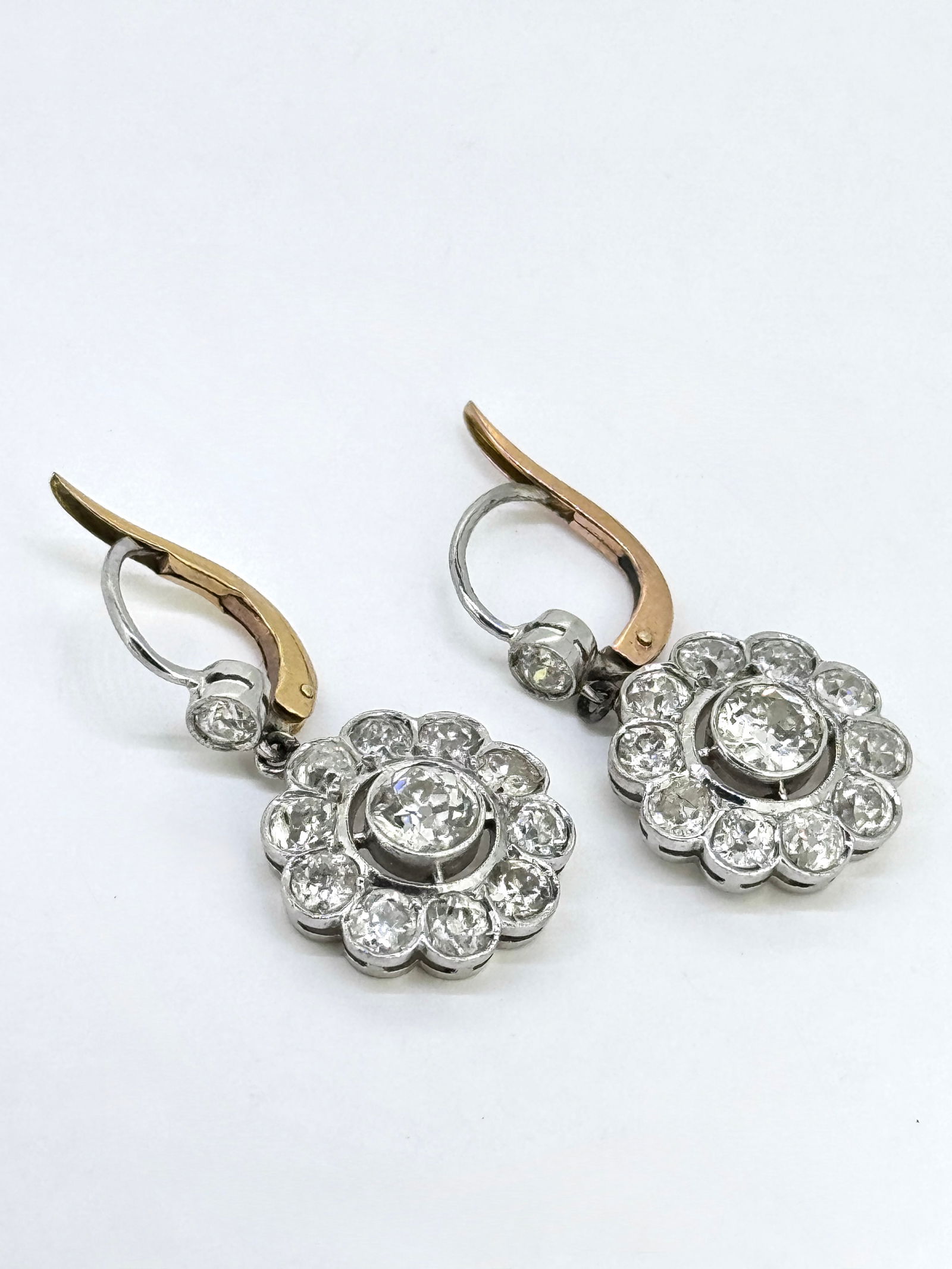 Vintage Edwardian Diamond Flower Cluster Two Tone Earrings.: Condition: Like New. Brand: Unbranded. Material: Platinum and 14k Rose Gold. Gemstone: 24 Old Mine-cut Diamond. Total Carat Weight: APX 3.5 TCW Clarity & Color: SI1-SI2; H-I Center Stone Dimensions: 6