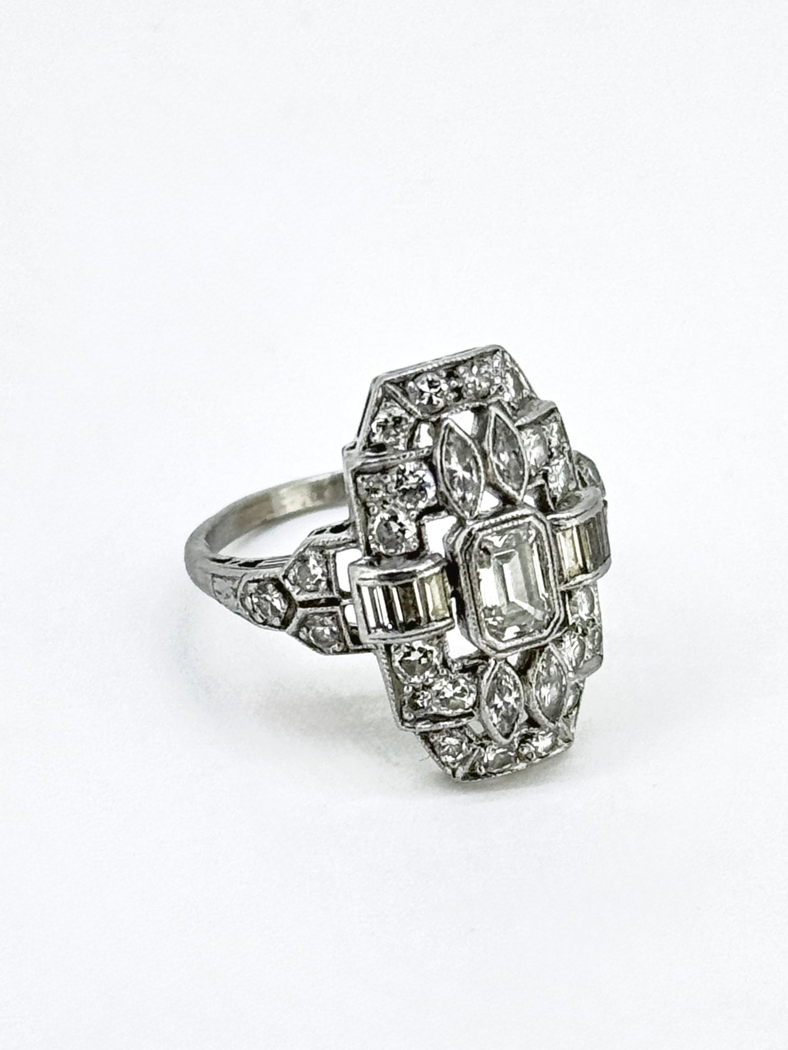 Antique Art Deco Platinum Old Cut Baguette Euro Diamond Shield Ring: Condition: Like New. Brand: Unbranded. Material: Platinum. Gemstone: Diamond.( Baguette, Pear, Round, Emerald cut) Total carat Weight: Over 1 Carat Diamond. Clarity and Color: VS2-SI1; H-I. Diamond Co
