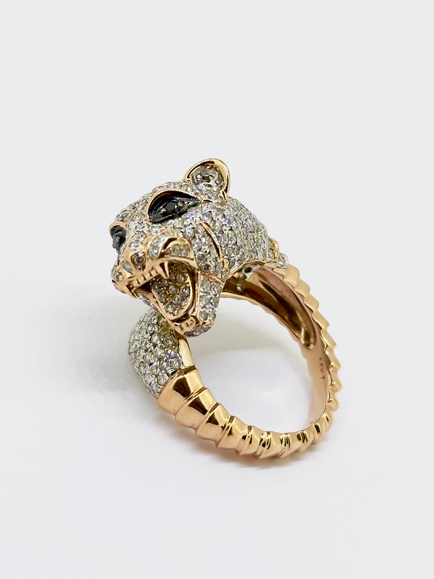 Limited Edition 14K Rose Gold Diamond Panther Head Ring, 2.69TCW: Condition: Like New. Brand: Unbranded. Metal Purity: 14k Rose Gold. Gemstone: Round Diamond and Black Onyx. Diamond Carat Weight: 2.69TCW Clarity and Color: VS1-VS2; G-H Ring Size: 6. Weight: 9.7 gram