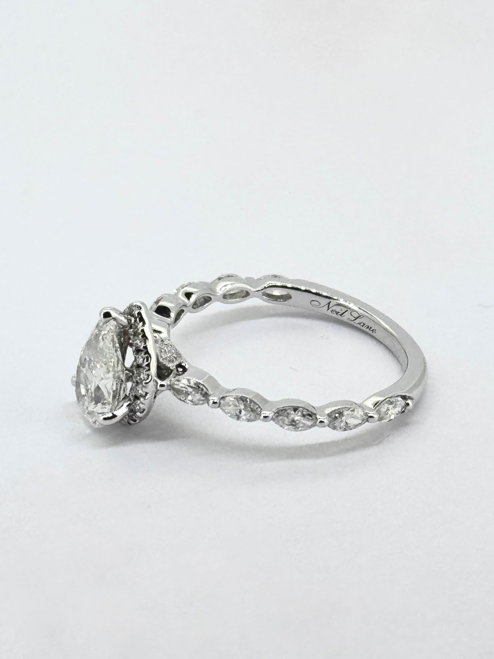 Neil Lane Premiere Pear-Shaped Diamond Engagement Ring in 14K White Gold: Condition: Like New. Brand: Neil Lane.. Metal Purity: 14k White Gold.. Gemstone: Pear-cut, Marquise-cut and Round Diamonds.. Diamond Count: 31 Round, 10 Marquise-cut and 1 Pear-cut.. Diamond Carat Wei